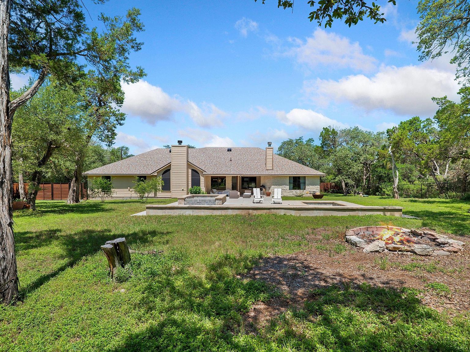 Kitchen with custom cabinetry and breakfast room overlooking the back lawn